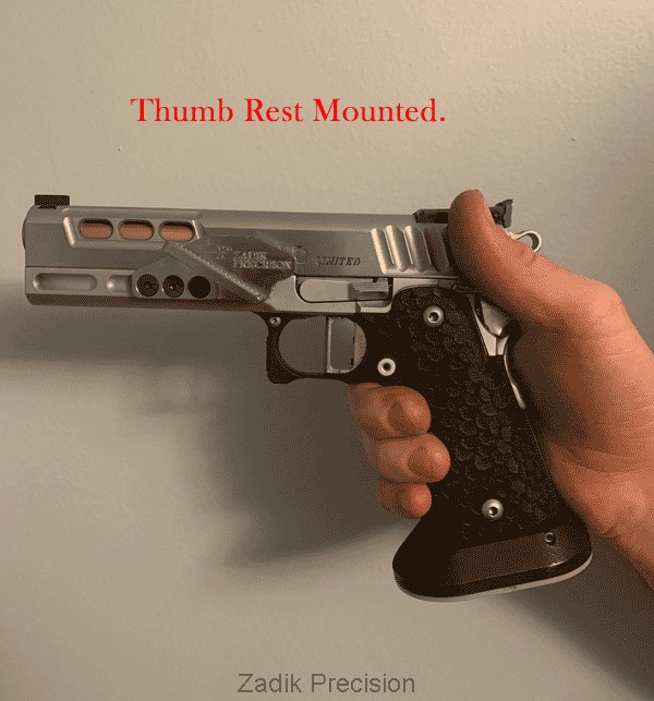 Thumb rest mounted on firearm.